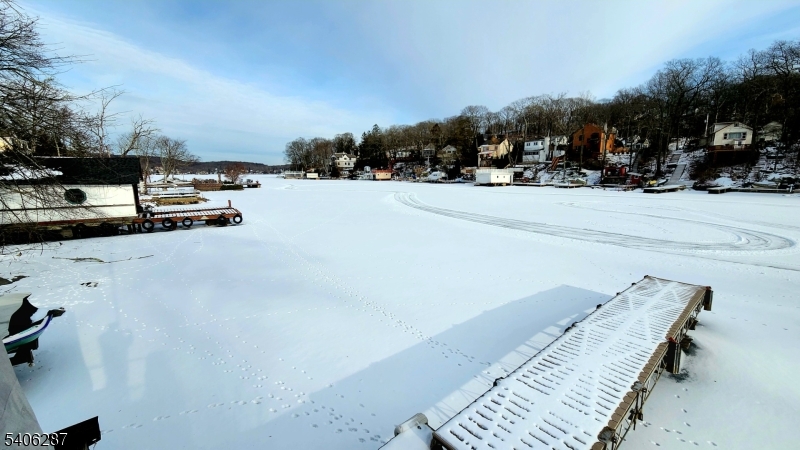 213 Squaw Trail Hopatcong, NJ 07821 - Photo 2 of 8 a view of the terrace with a bench and trees around