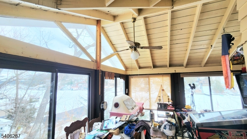 213 Squaw Trail Hopatcong, NJ 07821 - Photo 6 of 8 a room with furniture and large windows