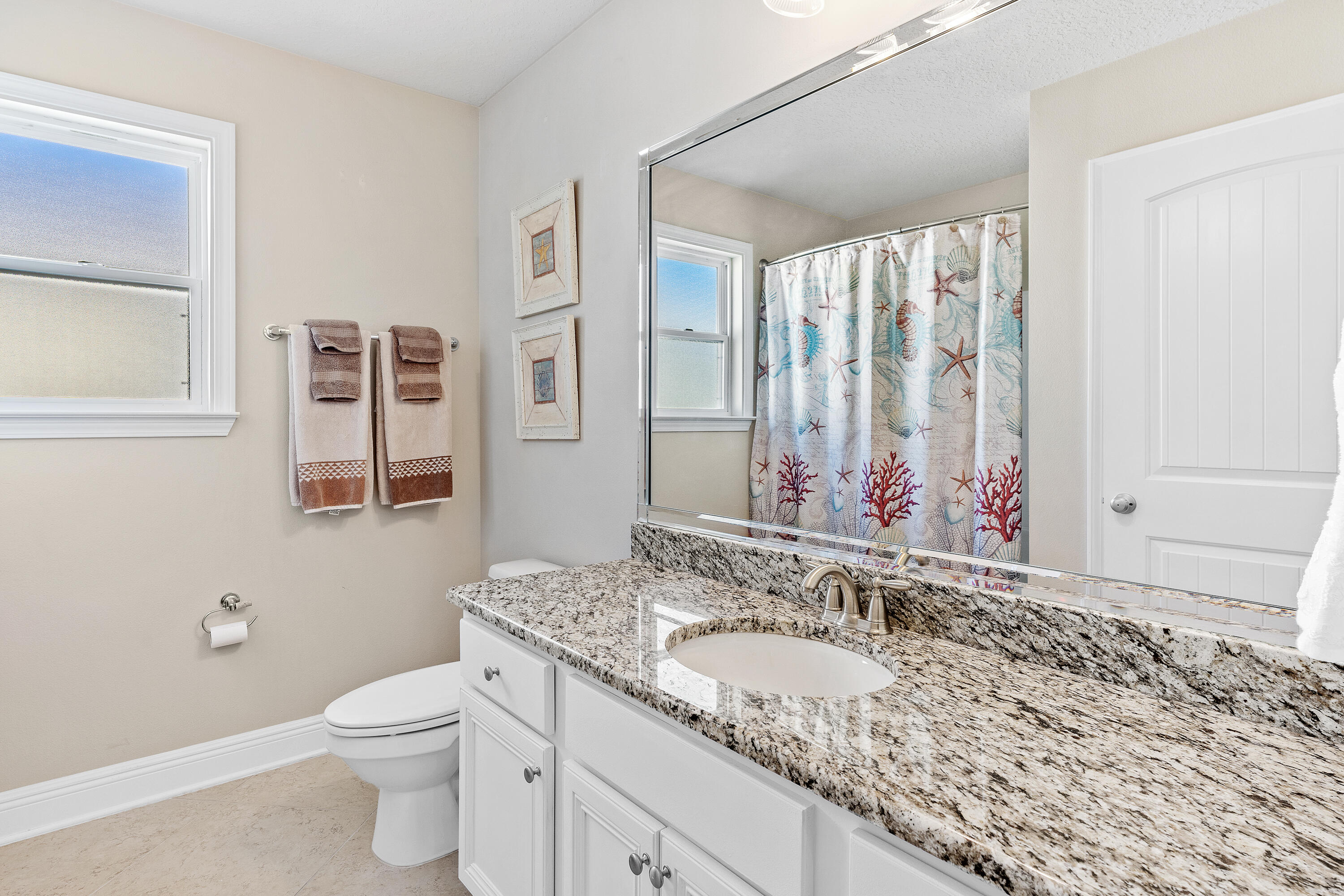 19 Topside Drive Inlet Beach, FL 32461 - Photo 31 of 40 a bathroom with a granite countertop sink and a mirror