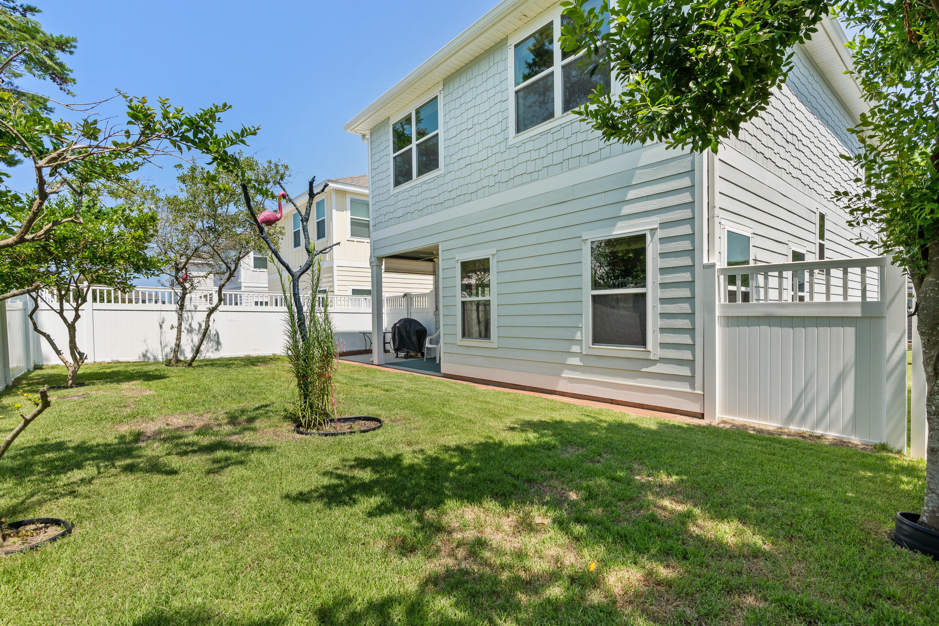 19 Topside Drive Inlet Beach, FL 32461 - Photo 36 of 40 a backyard of a house with seating space