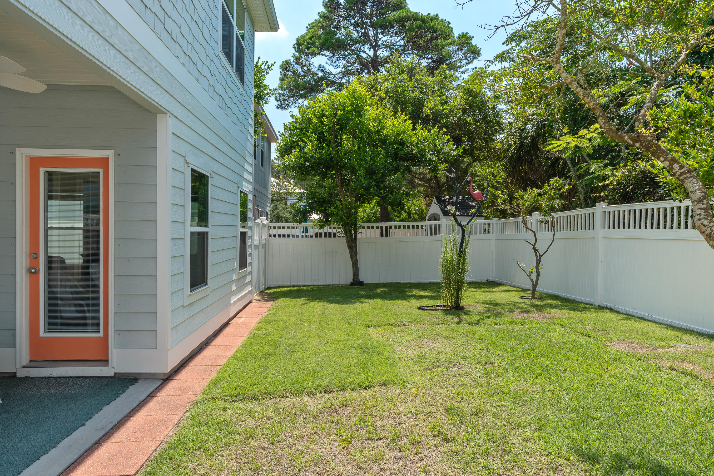 19 Topside Drive Inlet Beach, FL 32461 - Photo 37 of 40 a backyard of a house with plants and large tree