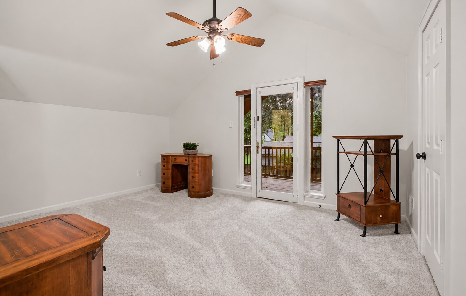 312 Springwood Drive Conroe, TX 77385 - Photo 30 of 50 First of two upstairs bedrooms provides ample space to use as a bedroom, home office or play room. It provides a door with a relaxing view to a private balcony.