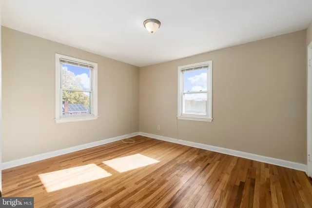 a view of a hallway with the wooden floor