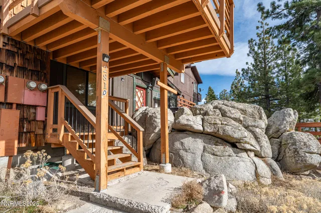 a view of balcony with furniture and garden