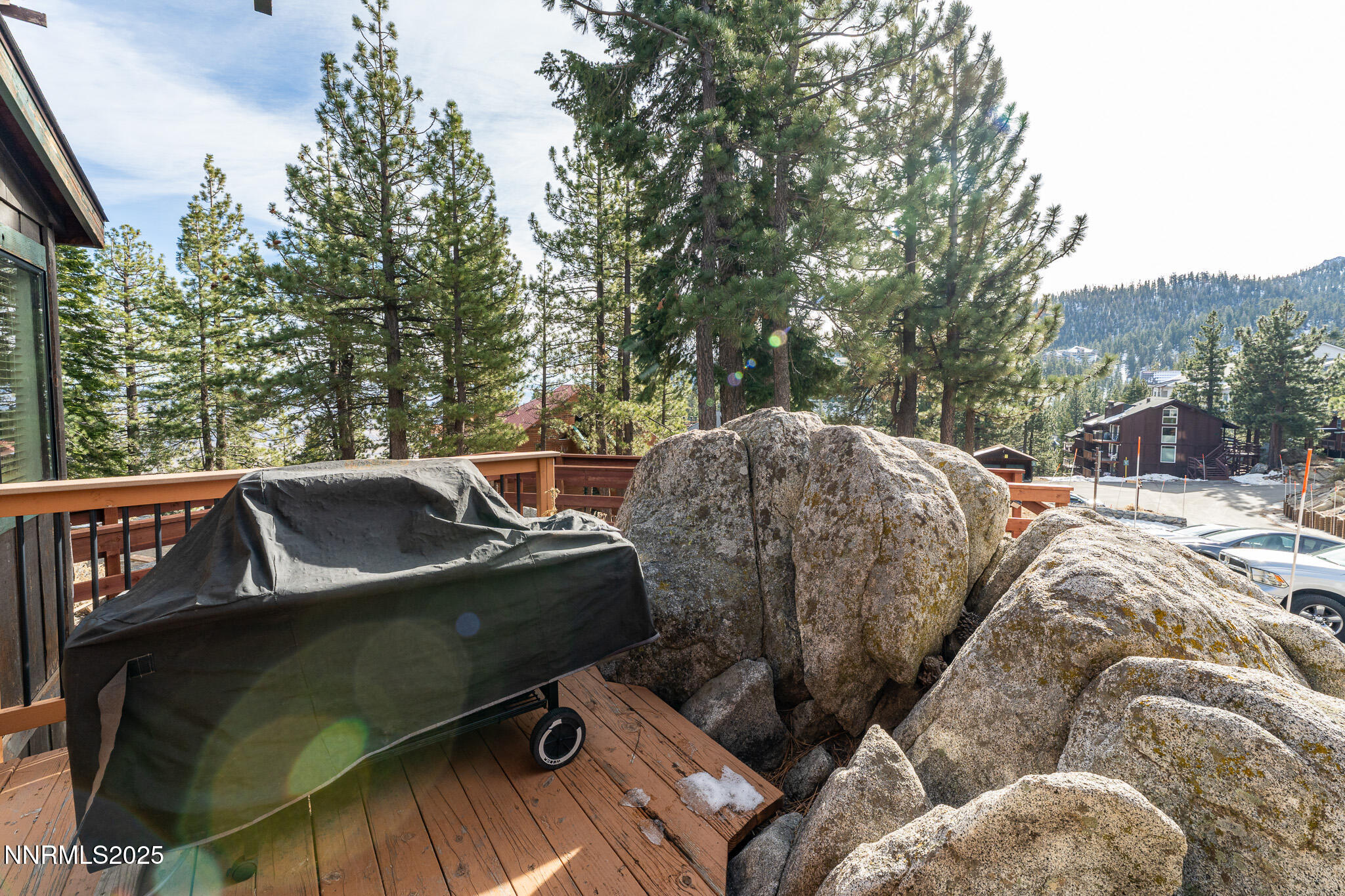 281 Orion Lane, Unit D Stateline, NV 89449 - Photo 15 of 33 a view of a roof deck with table and chairs a barbeque and potted plants