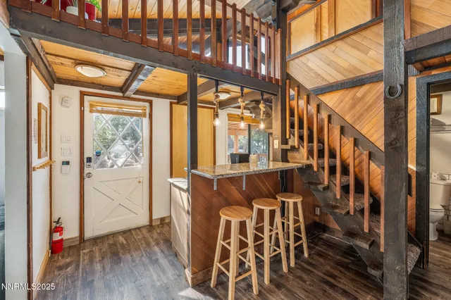 a bathroom with a granite countertop toilet a sink and bathtub