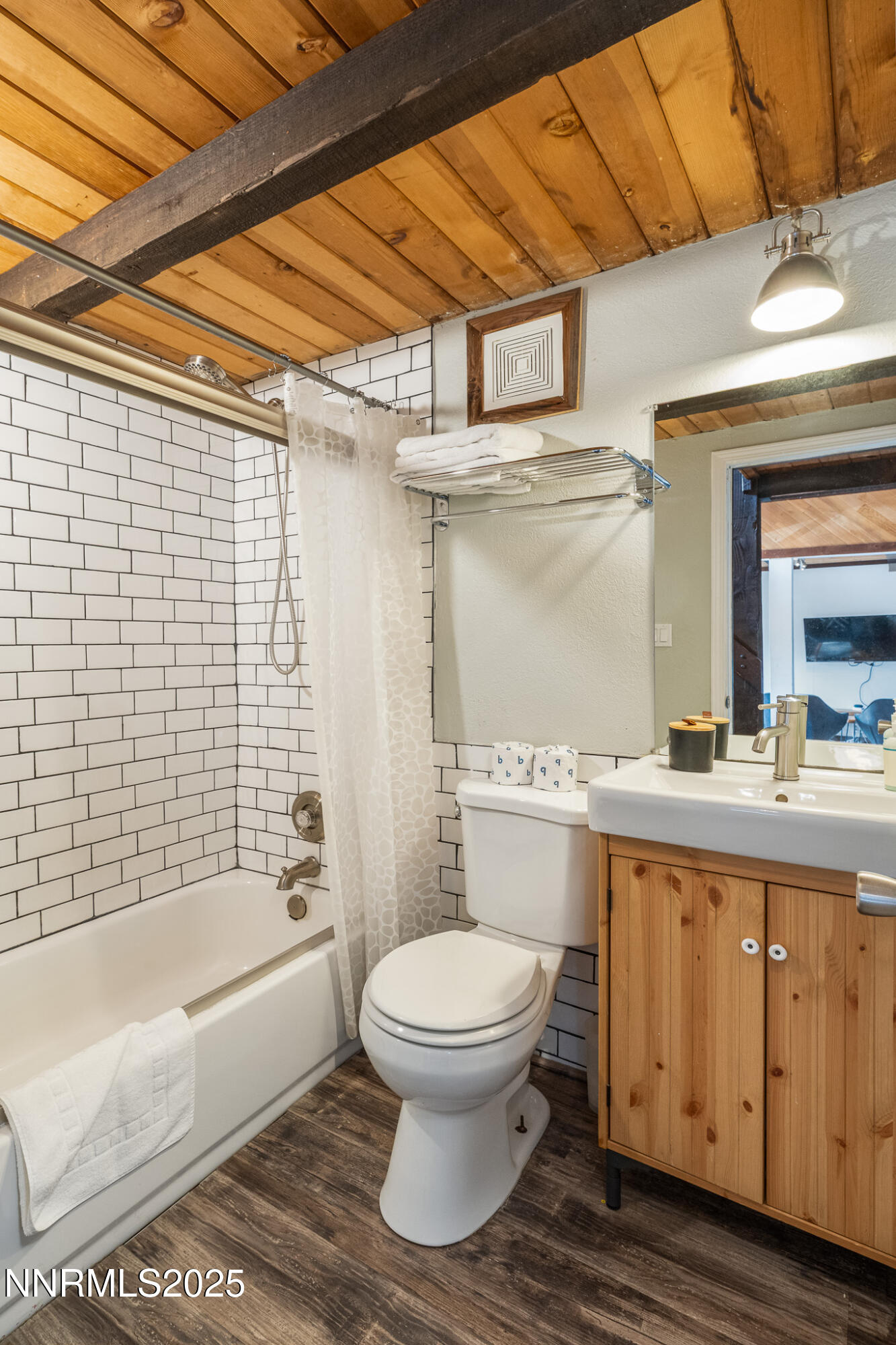 281 Orion Lane, Unit D Stateline, NV 89449 - Photo 25 of 33 a bathroom with a granite countertop toilet a sink and bathtub