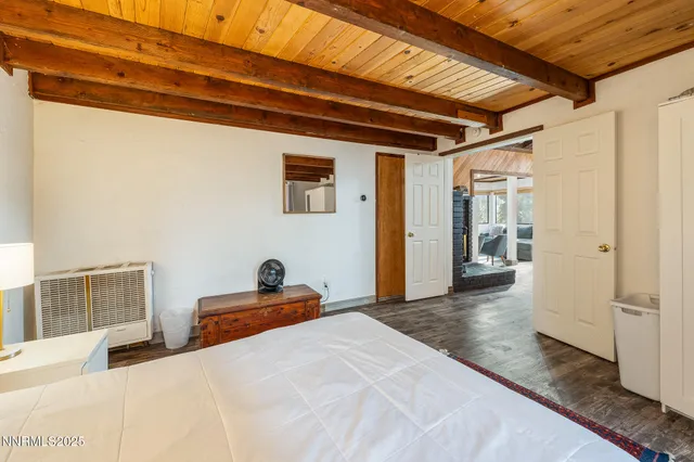 a bedroom with a bed and cupboard