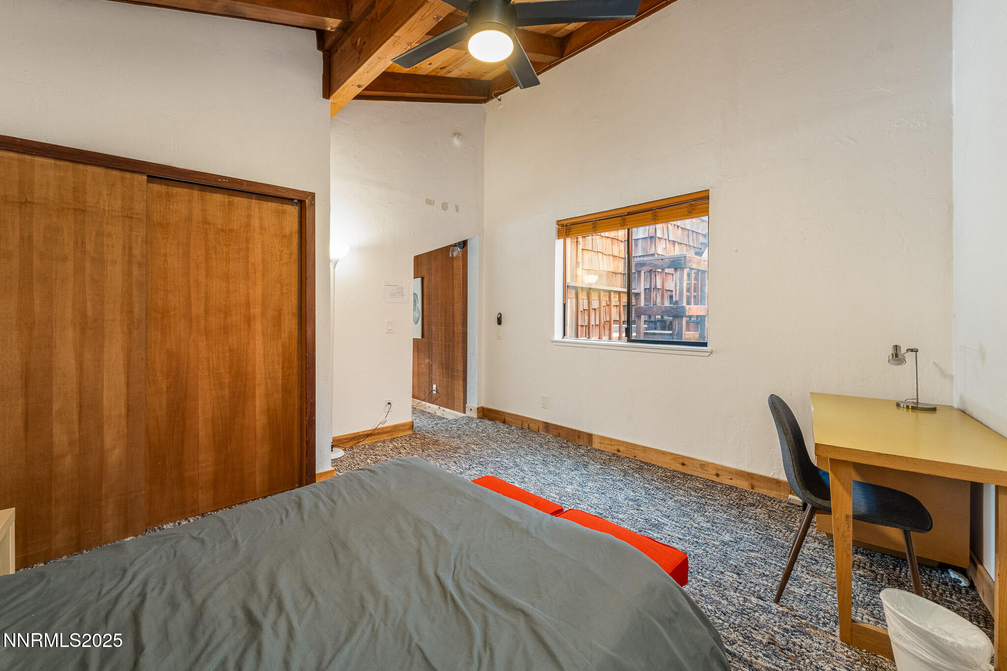 281 Orion Lane, Unit D Stateline, NV 89449 - Photo 32 of 33 a bedroom with a bed and a table in it