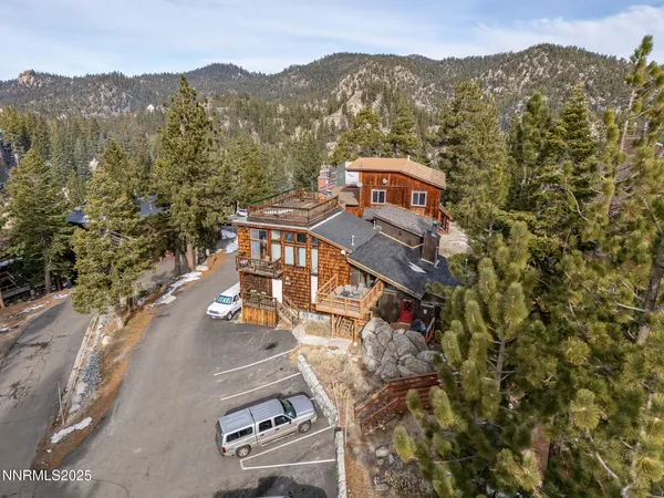 an aerial view of residential house and green space