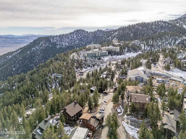 an aerial view of residential house and outdoor space