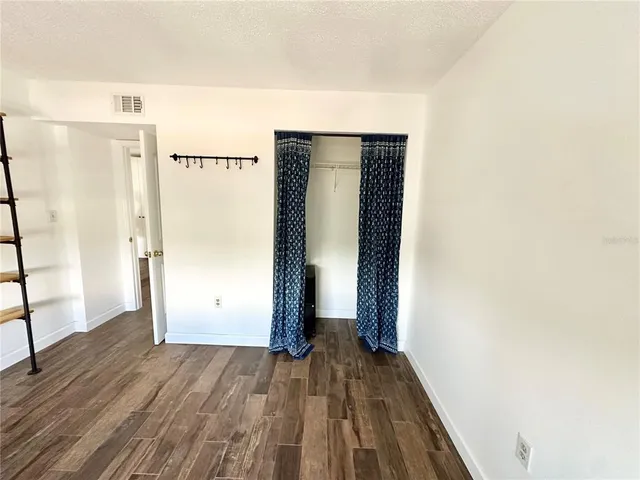 a view of staircase with white walls and a window