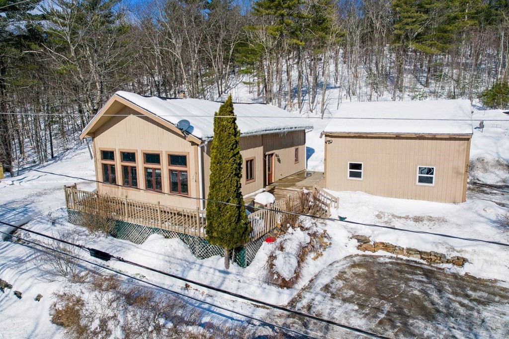 326 Mountain Road Lyndeborough, NH 03082 - Photo 2 of 41 a front view of a house with a yard