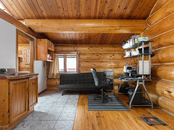 a bedroom with furniture and a window