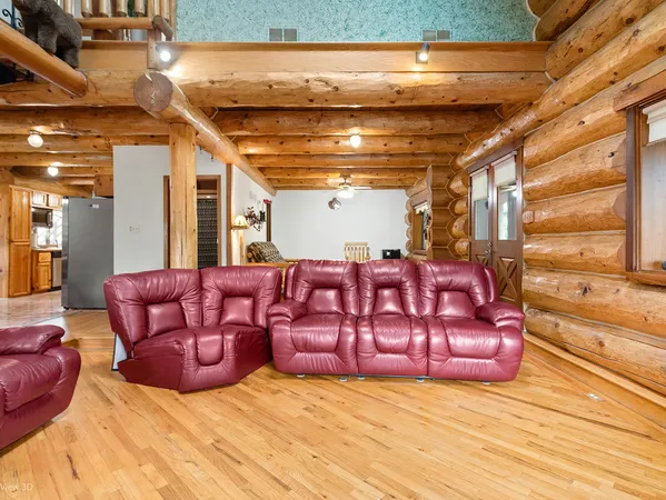 a backyard of a house with a yard and outdoor seating