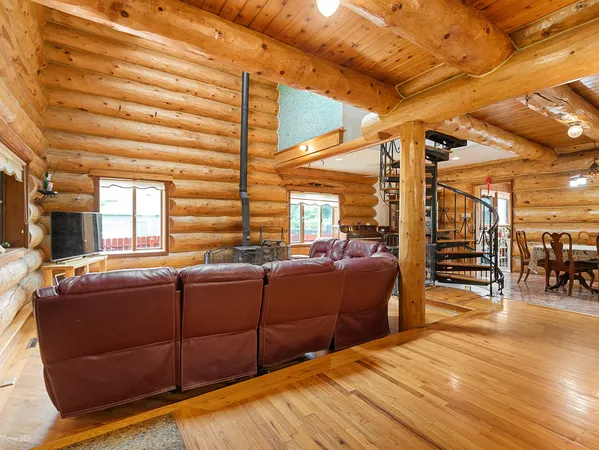 a view of an house with backyard porch and sitting area