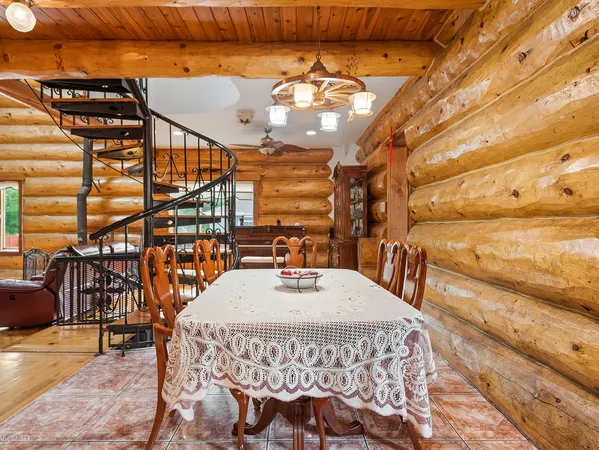 a view of a roof deck with wooden floor and seating space