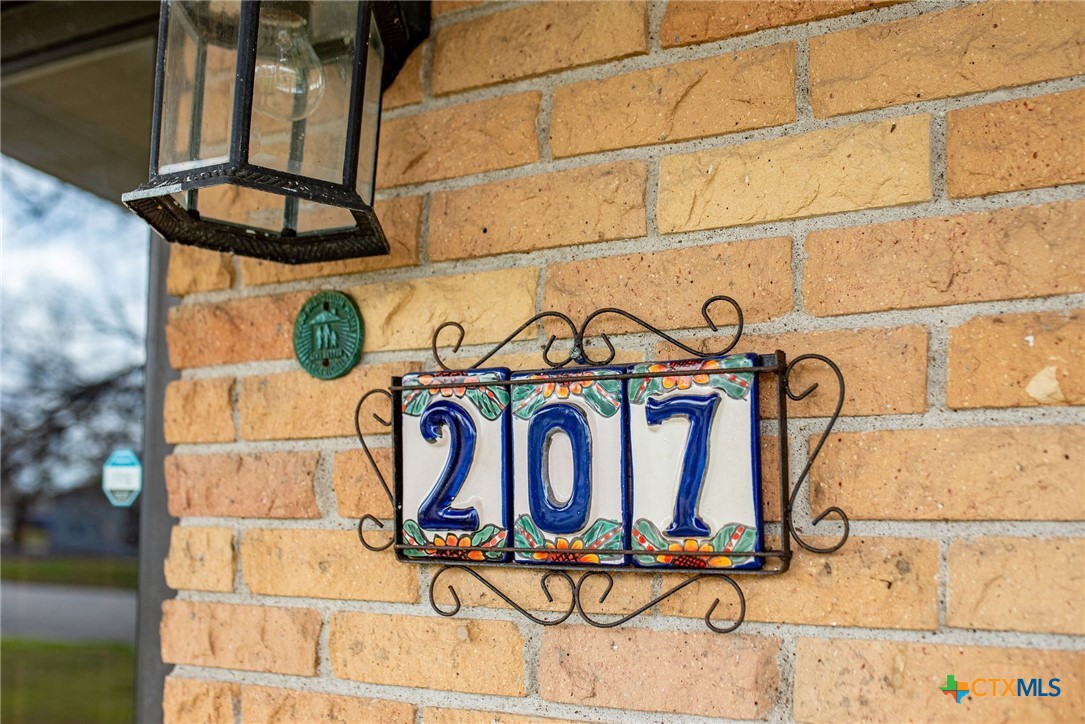 207 Williams Street Tivoli, TX 77990 - Photo 3 of 32 a street sign on a wall next to a building