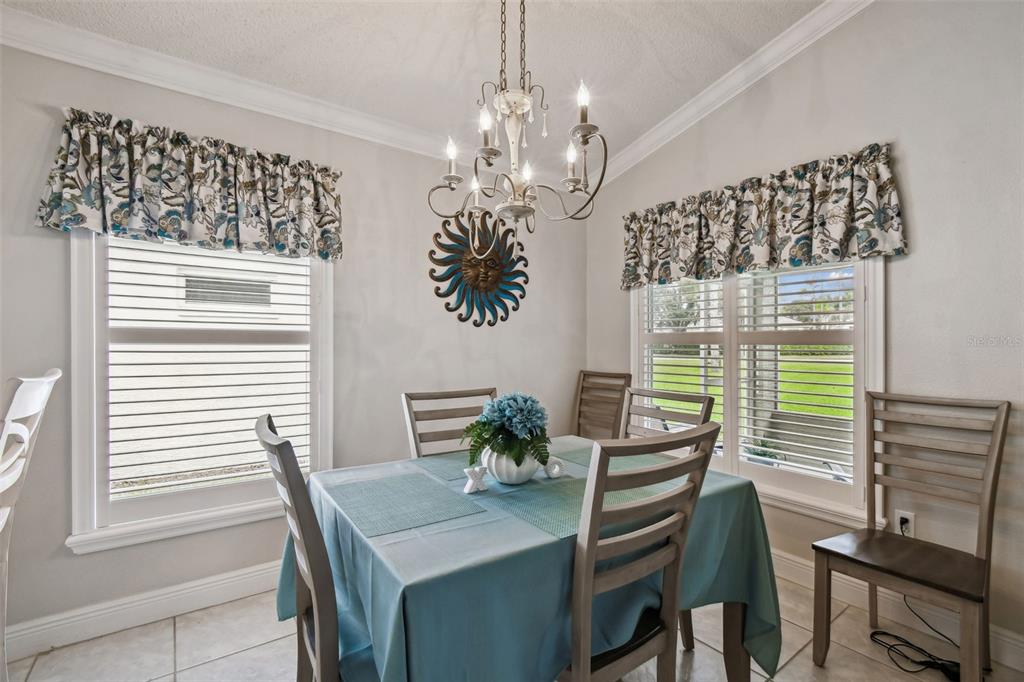11647 Wheatfield Loop Hudson, FL 34667 - Photo 17 of 62 a view of a dining room with furniture window and outside view