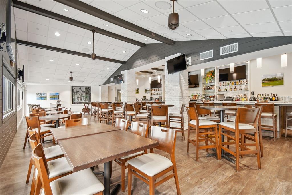 11647 Wheatfield Loop Hudson, FL 34667 - Photo 57 of 62 a view of a dining area with furniture
