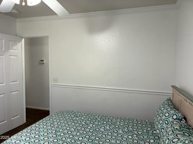 a bedroom with a bed and a dresser
