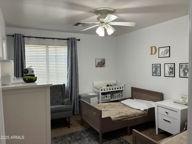 a living room with a couch and a chandelier