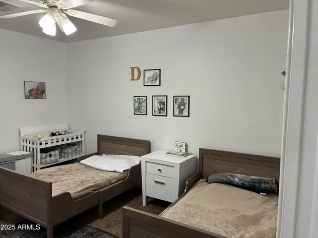 a view of bedroom with furniture and closet