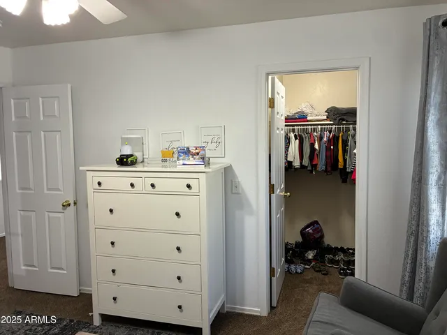 a bedroom with a bed and cabinets