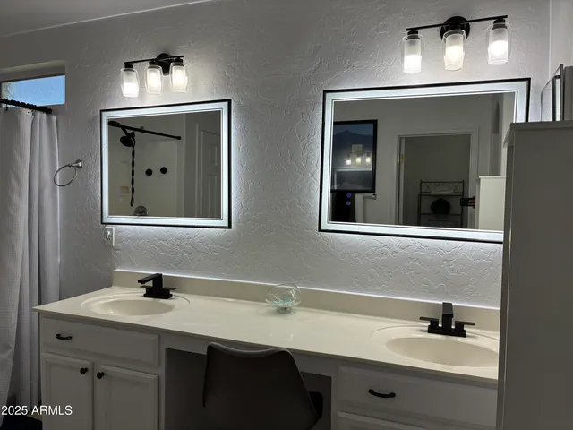 a bathroom with a bathtub and shower