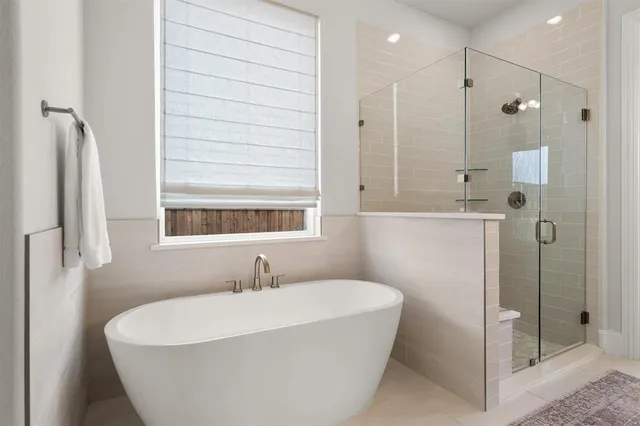 a en suite bathroom with a sink and a mirror