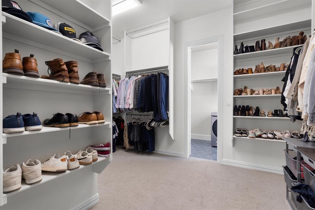 2560 Shady Trail Prosper, TX 75078 - Photo 19 of 40 a view of walk in closet with clothes and shoes