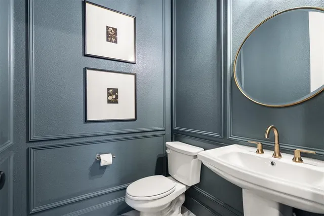 a view of a kitchen with a sink and a refrigerator