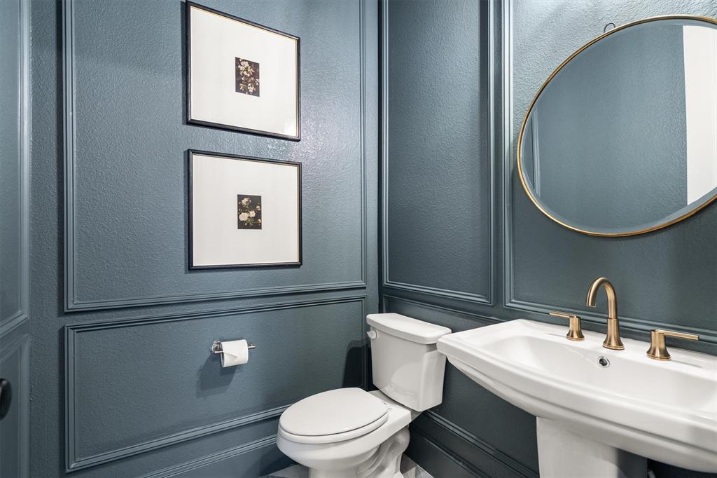 2560 Shady Trail Prosper, TX 75078 - Photo 21 of 40 a bathroom with a toilet sink and mirror