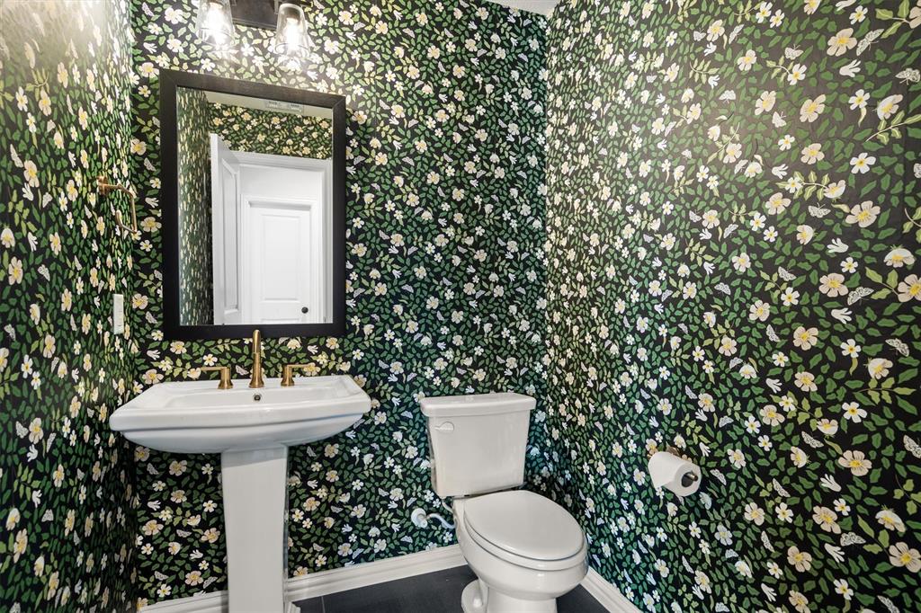 2560 Shady Trail Prosper, TX 75078 - Photo 24 of 40 a bathroom with a sink toilet and a mirror