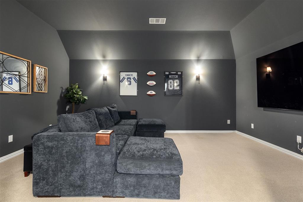 2560 Shady Trail Prosper, TX 75078 - Photo 25 of 40 a living room with furniture and a flat screen tv