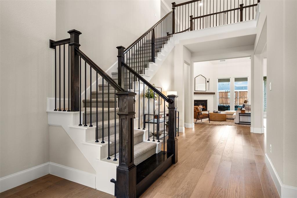2560 Shady Trail Prosper, TX 75078 - Photo 3 of 40 a view of staircase with white walls and a window