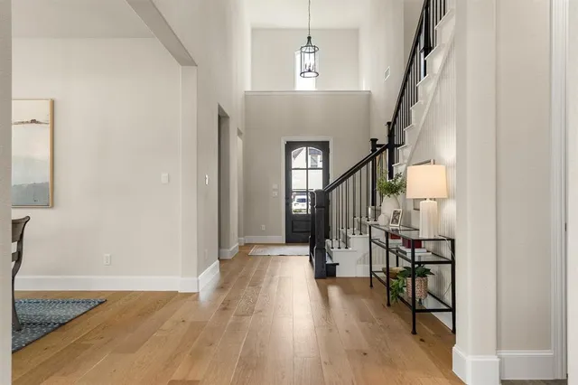 an aerial view of a swimming pool with outdoor seating and city view
