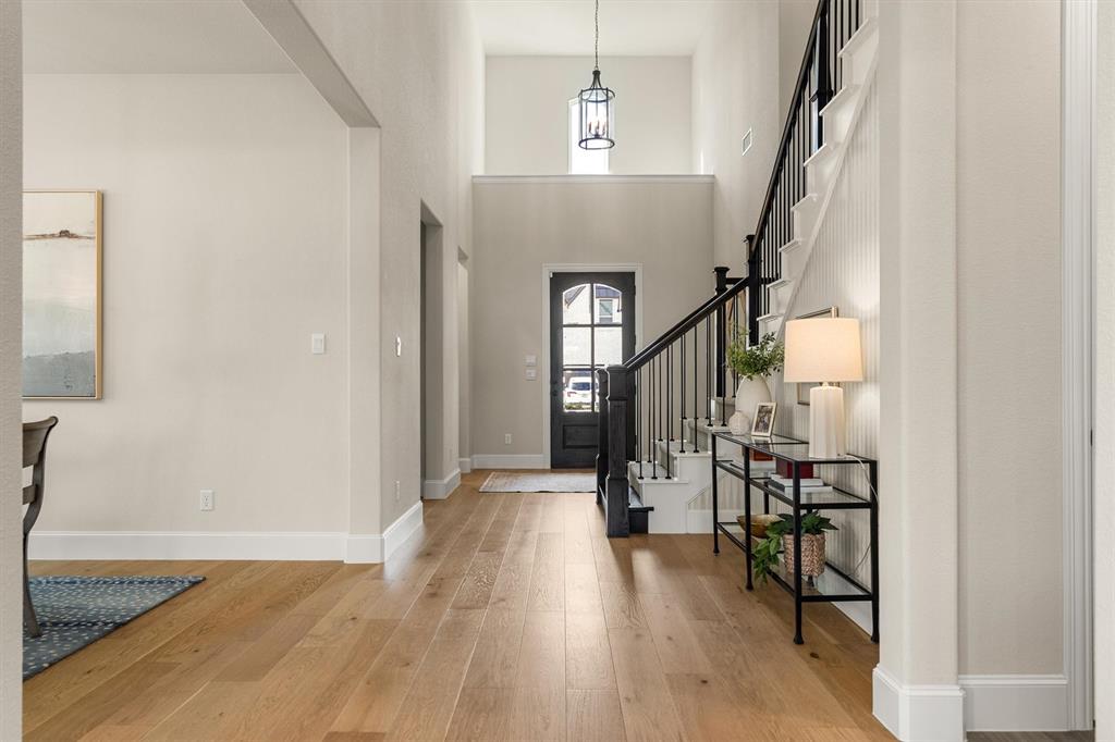 2560 Shady Trail Prosper, TX 75078 - Photo 4 of 40 a view of entryway and hall with wooden floor