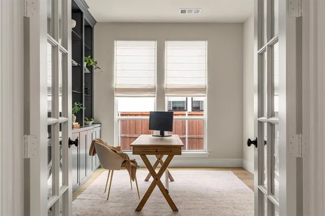 a view of staircase with white walls and a window