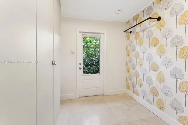 an aerial view of a house with a yard basket ball court and outdoor seating