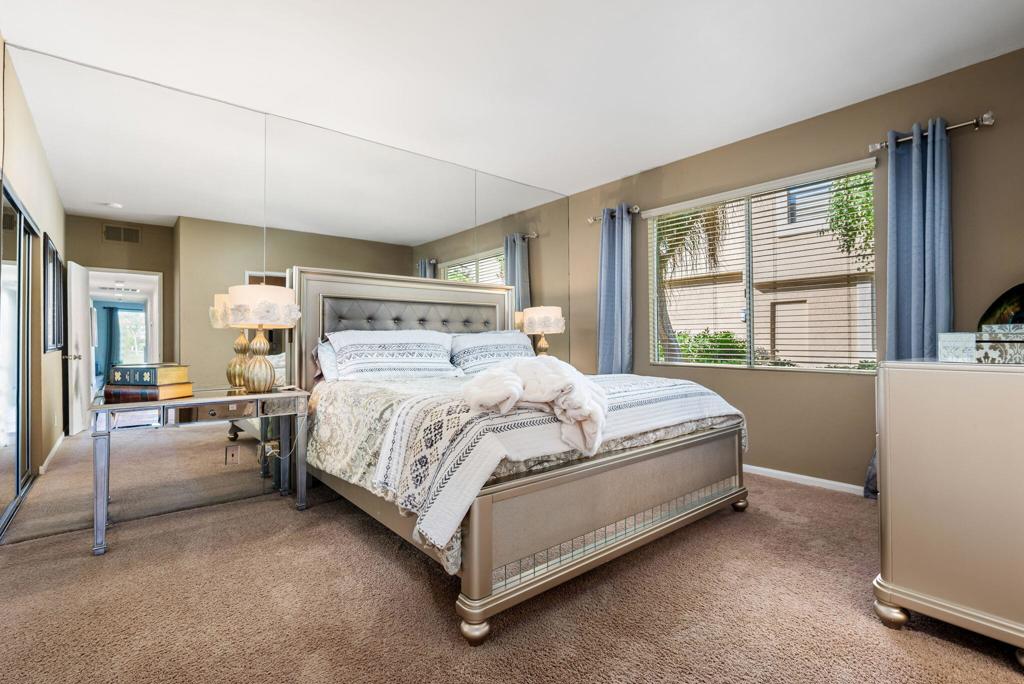 55406 Laurel La La Quinta, CA 92253 - Photo 12 of 50 a bed sitting in a spacious bedroom next to a window