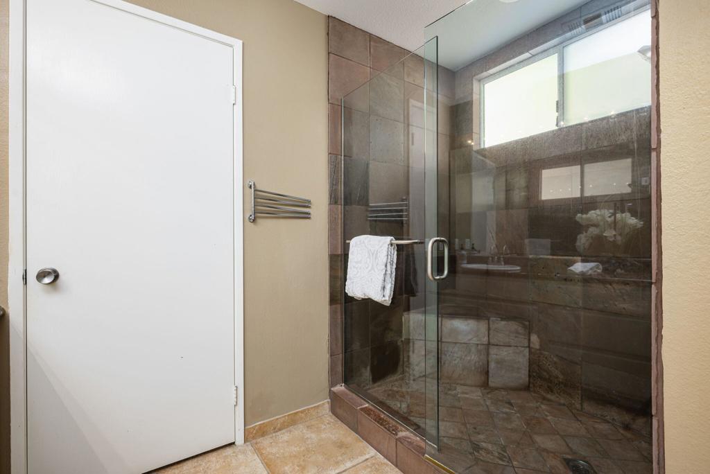 55406 Laurel La La Quinta, CA 92253 - Photo 15 of 50 a bathroom with a glass shower door
