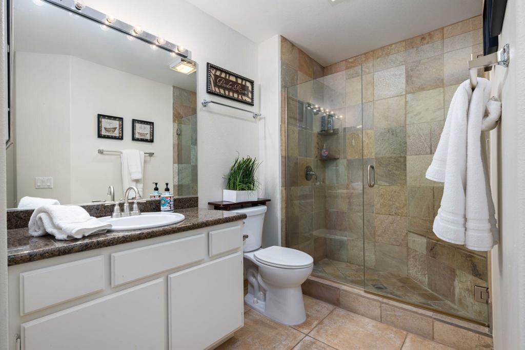 55406 Laurel La La Quinta, CA 92253 - Photo 17 of 50 a bathroom with a granite countertop sink toilet and shower