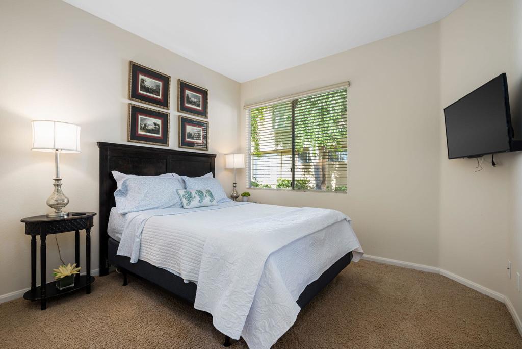 55406 Laurel La La Quinta, CA 92253 - Photo 18 of 50 a bedroom with a bed and a flat screen tv