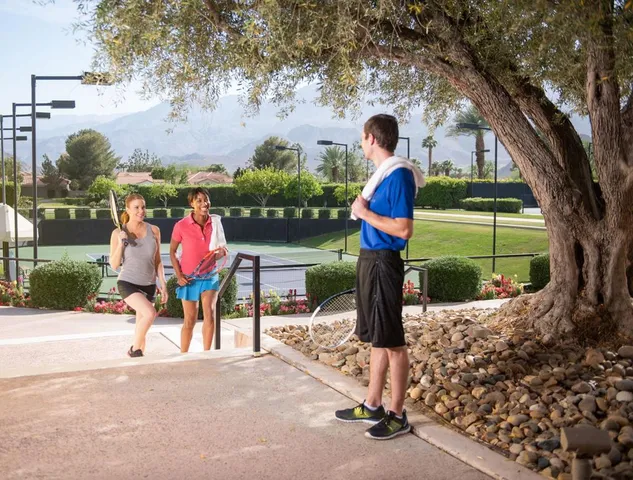 a childrens park with lots of swings and slides