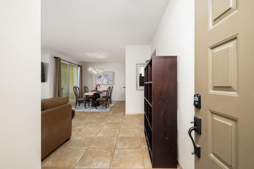 55406 Laurel La La Quinta, CA 92253 - Photo 3 of 50 a living room with furniture and a refrigerator