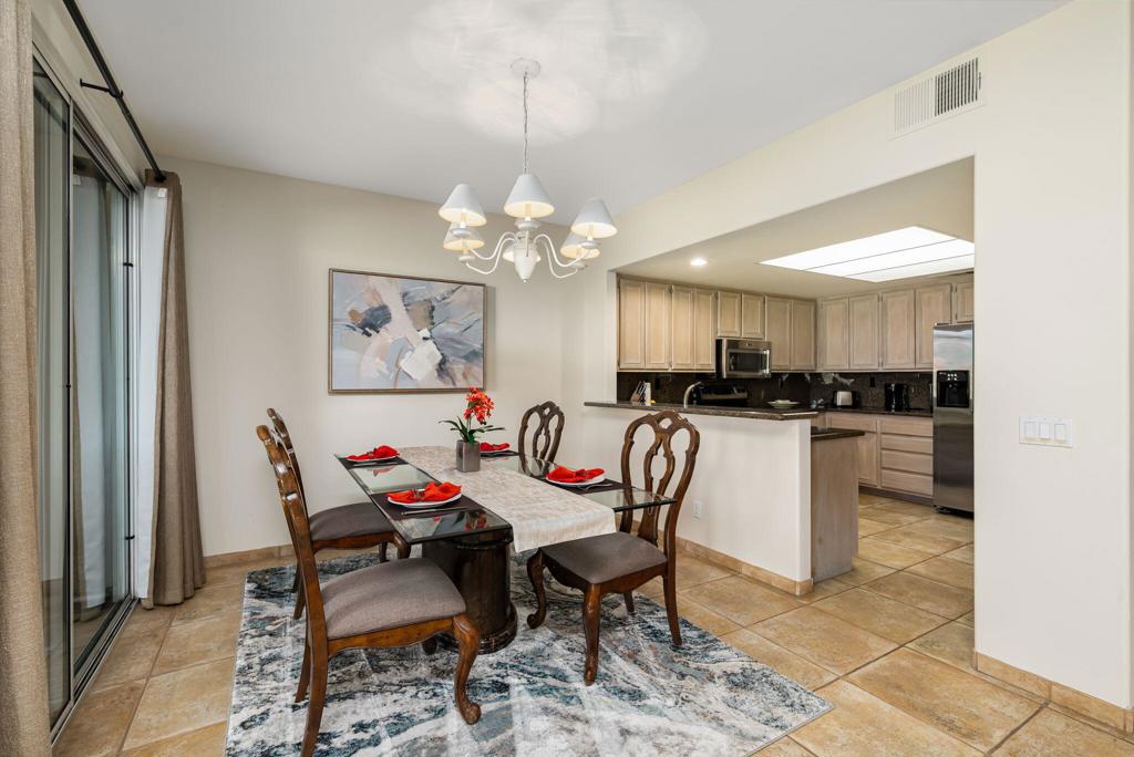 55406 Laurel La La Quinta, CA 92253 - Photo 7 of 50 a view of a dining room with furniture and a chandelier