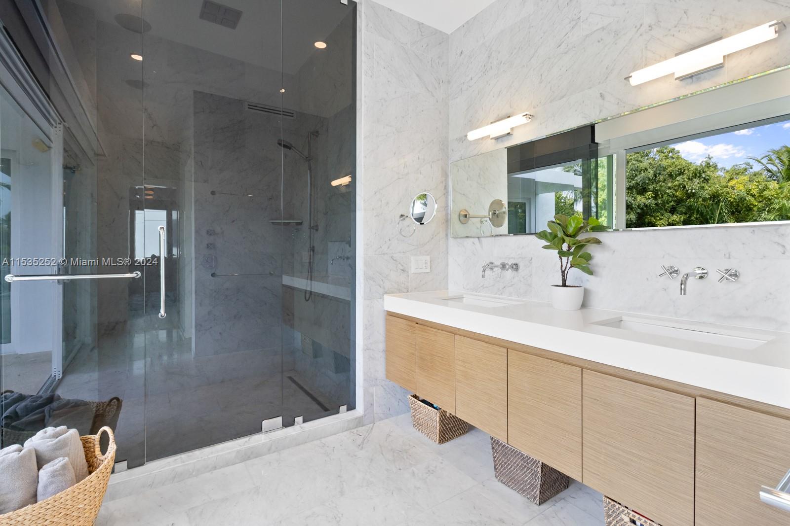 381 Beechwood Drive Key Biscayne, FL 33149 - Photo 13 of 23 a bathroom with a sink and a shower