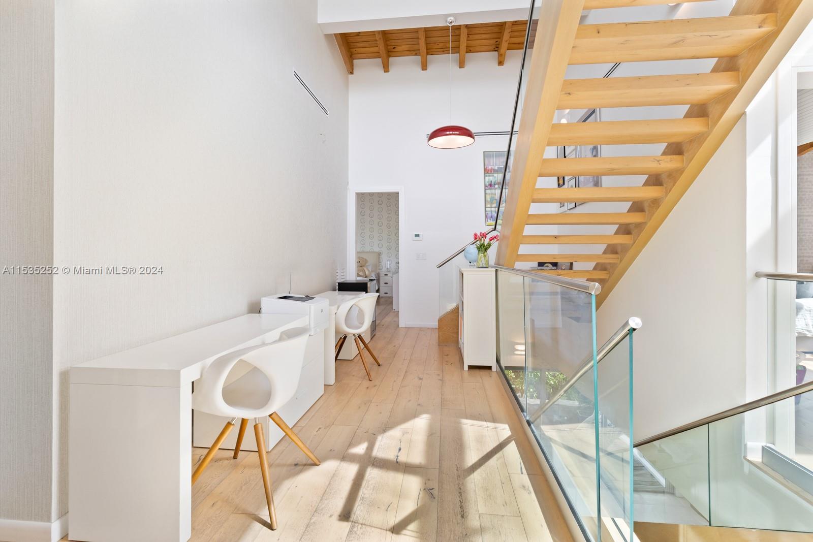 381 Beechwood Drive Key Biscayne, FL 33149 - Photo 19 of 23 a view of entryway and hall with wooden floor