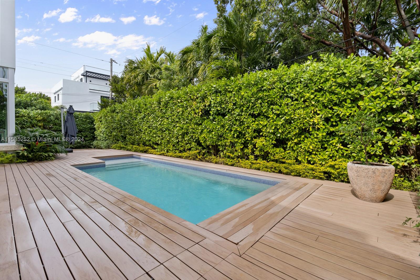 381 Beechwood Drive Key Biscayne, FL 33149 - Photo 6 of 23 a view of swimming pool from a balcony